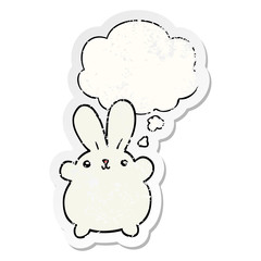 cute cartoon rabbit and thought bubble as a distressed worn sticker