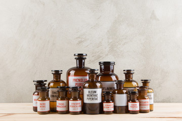 Retro pharmacy - vintage pharmacy bottles on wooden board