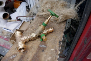 Jumble of tools and materials of a plumber in his assembly cart.