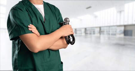 young doctor with hospital background