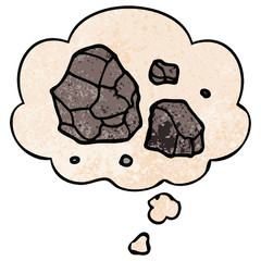 cartoon rocks and thought bubble in grunge texture pattern style