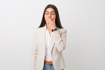 Young business arab woman isolated against a white background yawning showing a tired gesture covering mouth with hand.