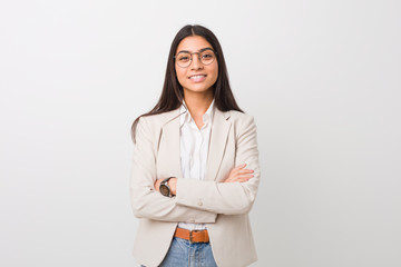Young business arab woman isolated against a white background who feels confident, crossing arms with determination.