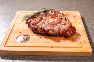 food, delicious and craft concept - cutting horse meat steak on wooden desk