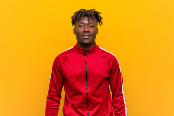 Young fitness african man happy, smiling and cheerful.