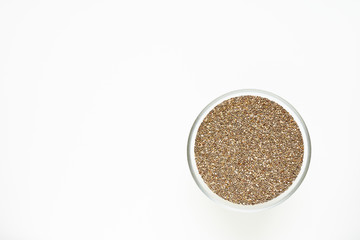chia seeds in a bowl on a white background