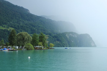 Fototapeta na wymiar Rain arriving at Lake Brienz, Switzerland.