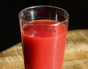 glass with strawberry, raspberry, and apple smoothie