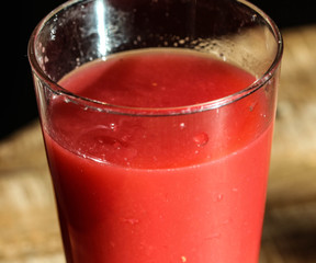 glass with strawberry, raspberry, and apple smoothie