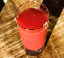 glass with strawberry, raspberry, and apple smoothie