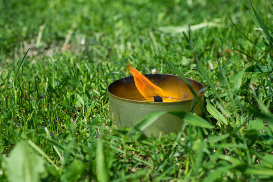 Insect repellent candle on the grass
