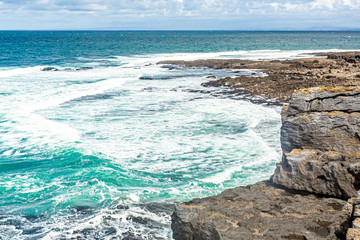 Beautiful view of the sea with its calm waters from Bothar nA hAillite, geopark geosites, Wild Atlantic Way, wonderful spring day in county Clare in Ireland