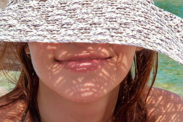 Girl in hat on beach