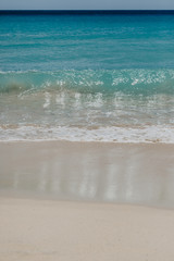 ocean landscape. sand beach and water of blue ocean