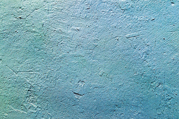 The texture of the concrete wall is blue and azure. Raw plaster wall background. The background of the sea waves.