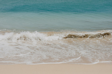 ocean landscape. sand beach and water of blue ocean