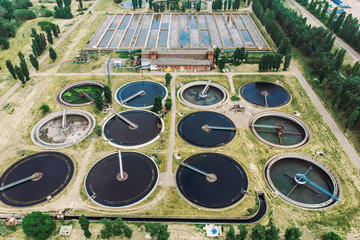 Aerial view of wastewater treatment plant. Dirty water cleaning facilities. Sewage purification