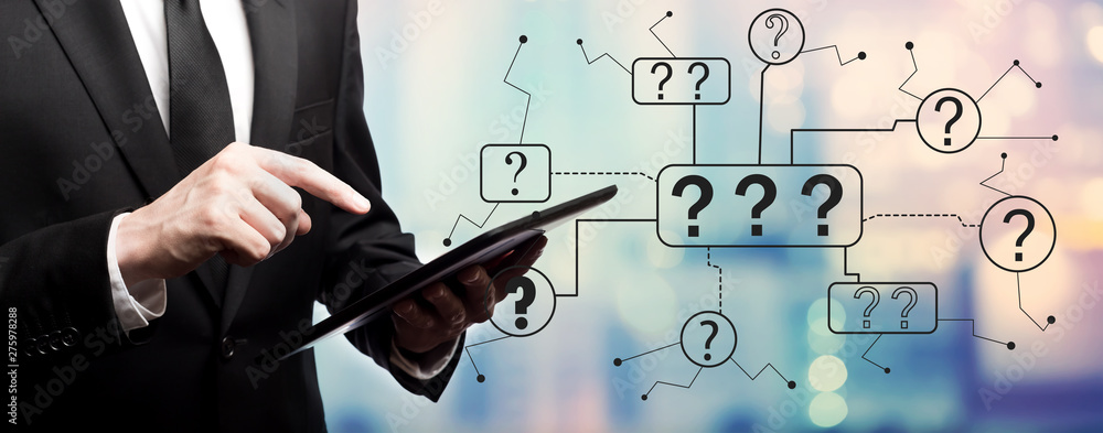 Poster question marks with businessman using his tablet computer