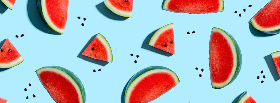 Sliced watermelons arranged on a blue background