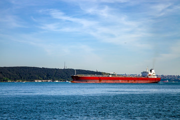 a red big freighter is going to Black Sea from Marmara Sea in Bosphorus, Istanbul.