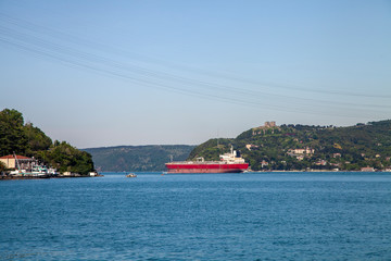 a red big freighter is going to Black Sea from Marmara Sea in Bosphorus, Istanbul.