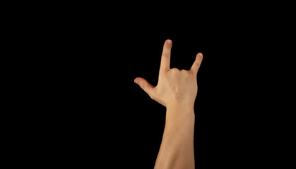 Fototapeta premium The hand of a young man on a black background