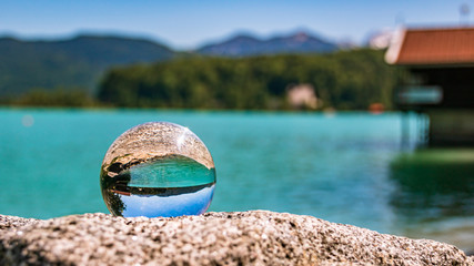 Crystal ball landscape shot of beautiful alpine view at the famous Walchensee - Bavaria - Germany