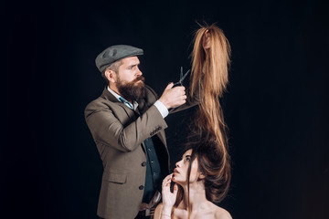 Advertising and barber shop concept. Hair Stylist and Barber. Woman getting haircut by hairdresser...