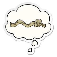 cartoon knotted rope and thought bubble as a printed sticker