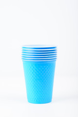 Blue plastic cups are isolated on a white background
