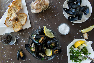 Cooked delicious black mussel with toasted bread and tasty sauce. Healthy eating concept, rich...