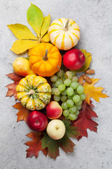 Naklejka na ściany i meble Autumn still life with pumpkins and fruits