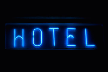 Blue Neon "Hotel" Sign At Night