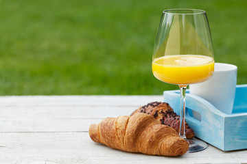 Coffee, orange juice and croissant
