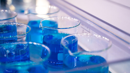 Testing Blue Solution In Glass Beaker