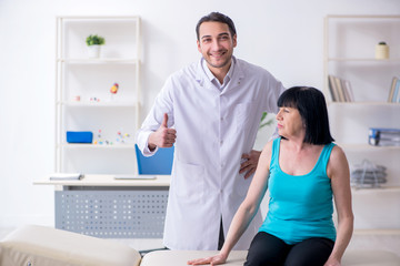 Fototapeta premium Mature woman patient visiting doctor