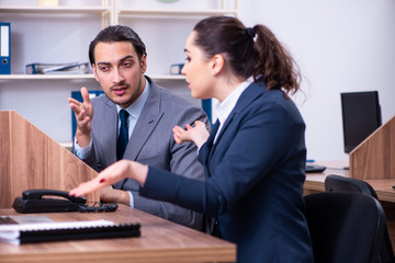 Two employees working in the office 