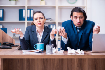 Two employees suffering at workplace 
