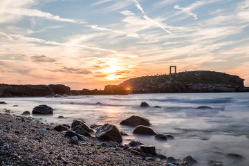 Sunset at the Portara in Naxos, Aegean in Greece