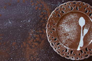 Top view of dessert empty plate on dark background. Yummy chocolate background with space for text or menu