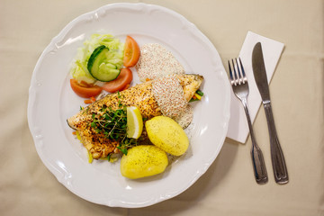 Fish with potatoes one the plate