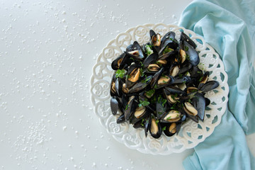 Cooked delicious black mussel, salty white background. Healthy eating concept, rich protein  food