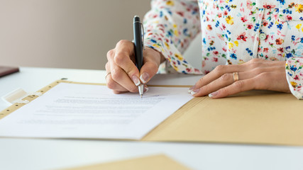 Businesswoman signing contract