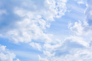 Blue sky background and fluffy white cloud in sunny day