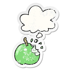 cartoon bitten apple and thought bubble as a distressed worn sticker