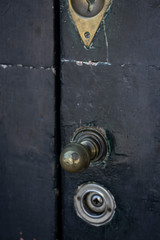 Vintage door handle and old black door