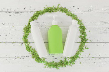 Flatlay still of toiletries. Bathroom stuff. Shower bottles. Tubes, soap and washcloth top view.