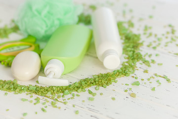 Flatlay still of toiletries. Bathroom stuff. Shower bottles. Tubes, soap and washcloth top view.