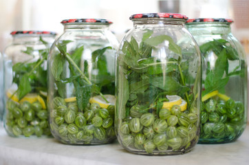 Pickled farm berries in glass jar. Morse