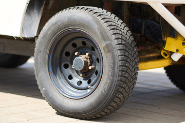 The front wheel of the old SUV